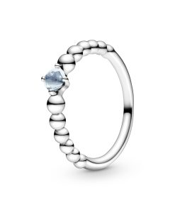 Sterling silver ring with treated aqua blue topaz