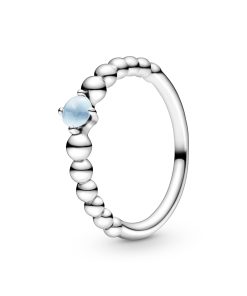 Sterling silver ring with treated sky blue topaz