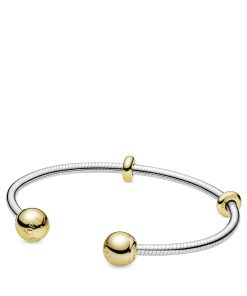 Sterling silver open bangle with 14k Gold Plated silicone stoppers and interchangeable end caps