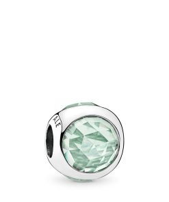 Silver charm with icy green crystal